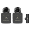 Two wireless microphone transmitter units with a receiver on a white background